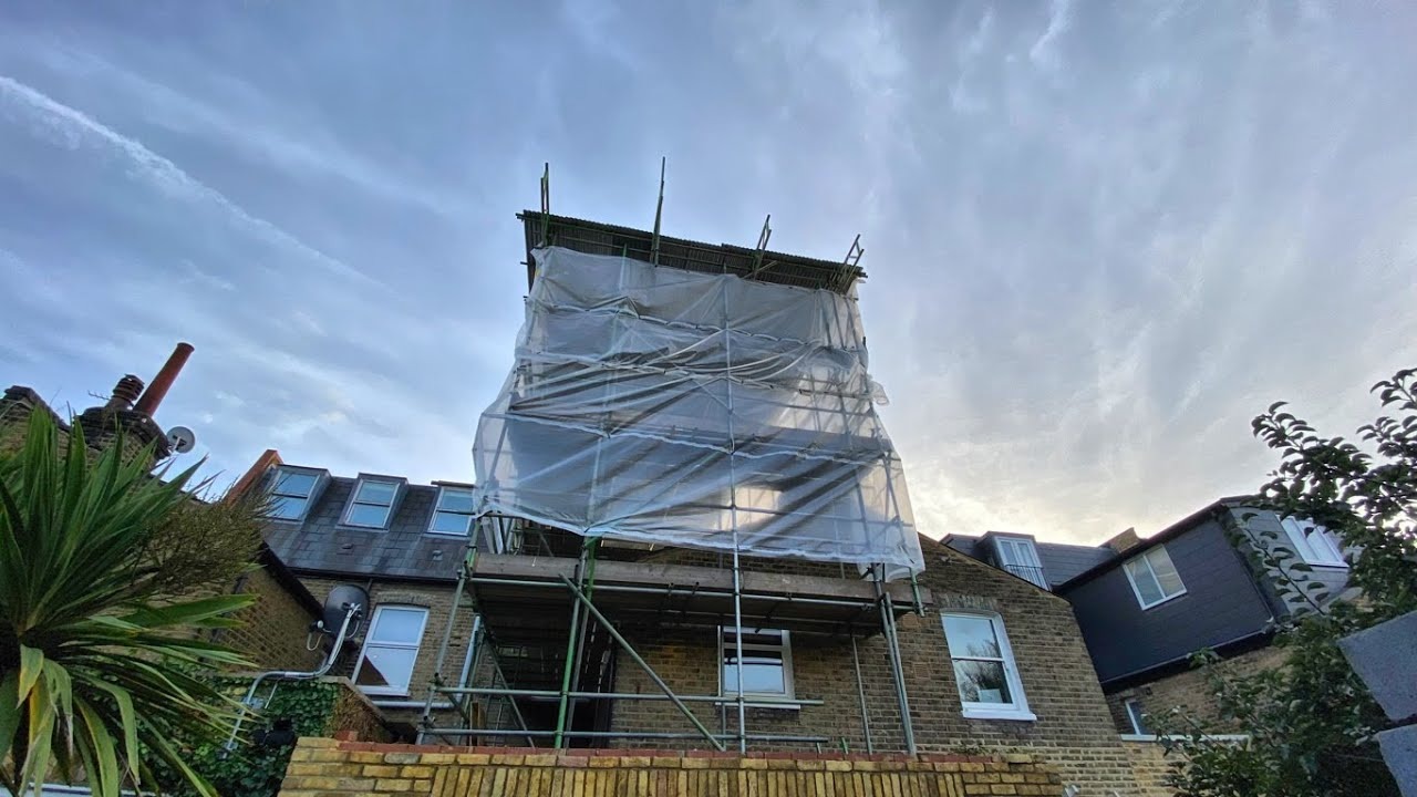 Professional scaffolding on Victorian London terraced house